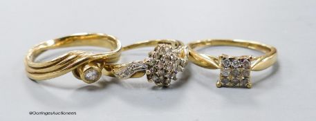 Three assorted modern diamond set dress rings, two stamped 9ct gold and one stamped 375, gross