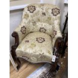 A Victorian upholstered carved mahogany tub chair. W-64, H-86cm.