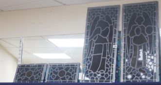 Two stained glass figural panels, 64 x 27cm, and two smaller panels of crowns