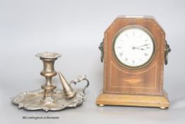 An Edwardian mahogany mantel timepiece, together with a silver plated chamberstick