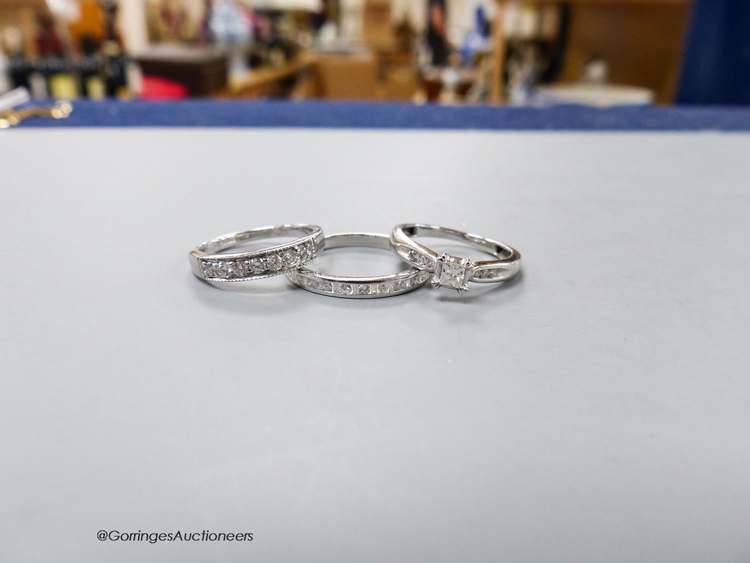 Two modern 9ct white gold and diamond set rings including a seven stone half hoop and a white metal - Image 2 of 3