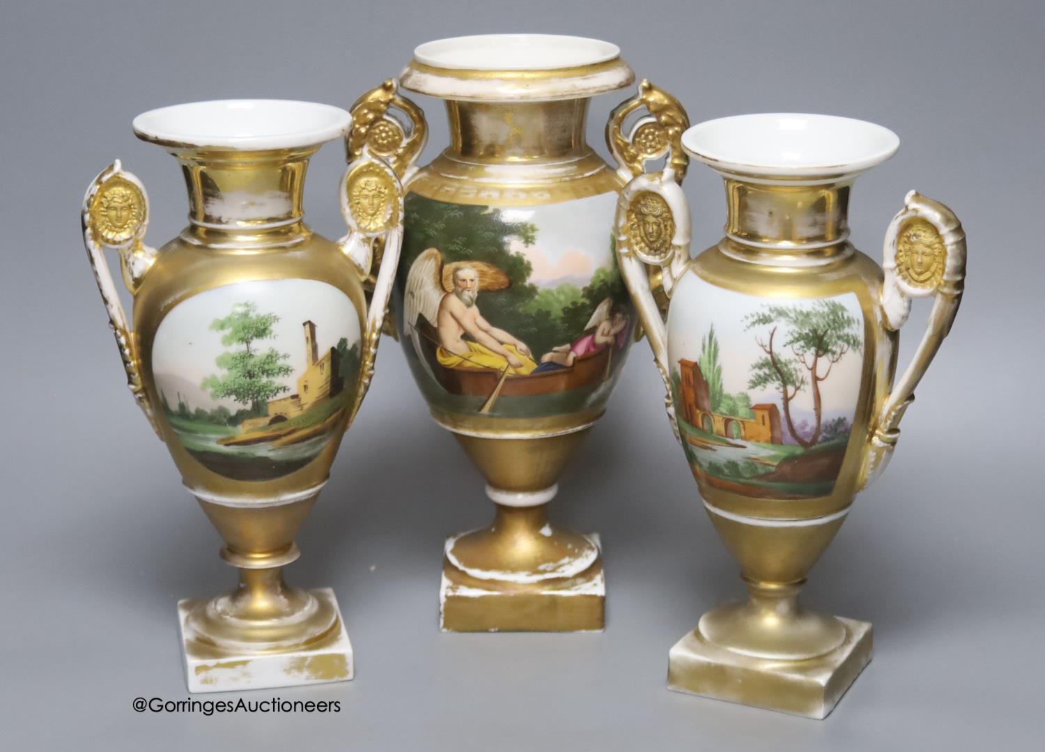 A 19th century French porcelain garniture of three vases, height 27cm