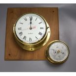 A Westclock brass wall timepiece and a barometer