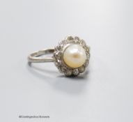A 1920's white metal (stamped platinum), cultured pearl and old cut diamond set circular cluster