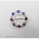 An early 20th century yellow metal, amethyst, sapphire and diamond chip set openwork circular