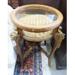 An early 20th century circular bijouterie table with applied cast gilt metal figural mounts, 68cm