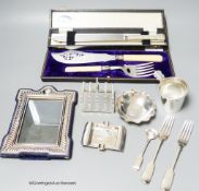 A small group of assorted silver including cup holder, dessert forks, mustard ladle, ashtray, a