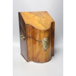 A George III serpentine mahogany veneered knife box, height 35cm