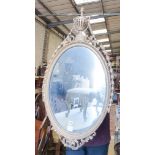 A Victorian oval giltwood and gesso wall mirror, width 56cm, height 104cm