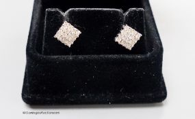 A modern pair of 18ct white gold and diamond encrusted square ear studs, 5mm, gross weight 2.7