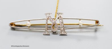 An early 20th century 15ct yellow metal, diamond and seed pear set 'initial M' bar brooch, 50mm,