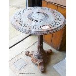 A Victorian Aesthetic movement cast iron circular garden table in the manner of Christopher