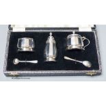 A cased modern silver three piece condiment set, with two spoons, Birmingham, 1954.