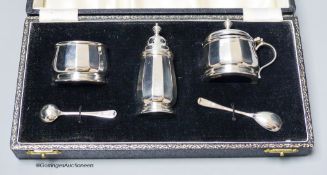 A cased modern silver three piece condiment set, with two spoons, Birmingham, 1954.