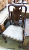 A set of four George I walnut dining chairs on front cabriole legs