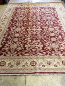 A Zeigler style burgundy ground carpet, 315 x 246cm