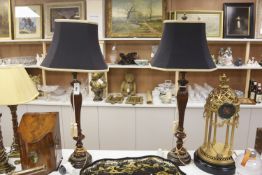 A pair of carved and giltwood table lamps and shades, overall height 100cm
