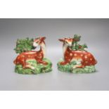 A pair of early 19th century Staffordshire pearlware models of deer, height 13cm