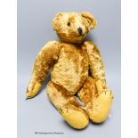 A cotton plush teddy bear, 'Bingo', straw-filled,with boot button eyes, long snout and humped