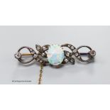 A late Victorian white opal and diamond cluster set scroll bar brooch, 43mm, gross 5.9 grams.