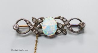 A late Victorian white opal and diamond cluster set scroll bar brooch, 43mm, gross 5.9 grams.