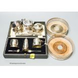 A modern pair of silver wine coasters, a cased silver condiment set and plated items.