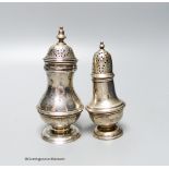 A Victorian silver baluster pepper pot, Charles Stuart Harris, London 1897, 11.2cm and an Edwardian