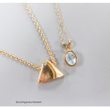 A 14ct gold triangular pendant on 14ct gold chain, gross 5.7 grams, an aquamarine pendant on 9ct