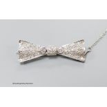 A modern Art Deco style 18ct white gold and diamond encrusted 'bow tie' brooch, 40mm, gross 7.1