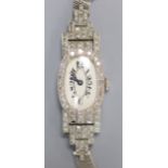 A lady's mid 20th century white metal (stamped platinum) and diamond set cocktail watch, with