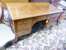 An Edwardian satinwood banded mahogany kneehole dressing table, width 122cm, depth 58cm, height
