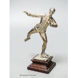 An Edwardian silver miniature model of an ice skater, Elkington & Co Ltd?, London, 1904, on a