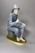 A Lladro gent with pipe