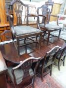 A set of eight Hepplewhite style mahogany dining chairs. (two having arms)