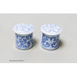 A pair of Chinese blue and white scroll ends, height 3.5cm