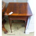 An Edwardian mahogany work table, with twin hinged flap top, W.44cm D.44cm H.69cm