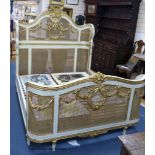 A Louis XVI style painted, giltwood and caned double bed frame, width 160cm, length 212cm, height