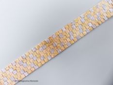 A three-colour 9ct yellow and white gold mesh bracelet, 17.7cm, 51.1 grams.