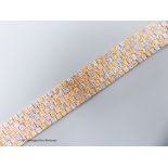 A three-colour 9ct yellow and white gold mesh bracelet, 17.7cm, 51.1 grams.