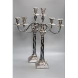 A pair of Georgian style plated two-branch three-light candelabra, height 53cm