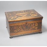 An unusual George IV ebony and marquetry inlaid tea caddy, 32cm