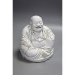A Chinese blanc de chine porcelain model of Budai, height 16cm