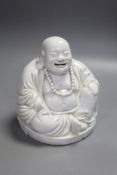 A Chinese blanc de chine porcelain model of Budai, height 16cm