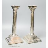 A pair of 1960's silver Corinthian column candlesticks, D J Silver Repairs, London, 1967, 30cm,