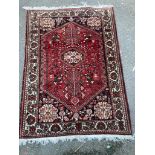 A Belouch red ground rug, 148 x 108cm