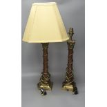 A pair of rouge marble and gilt metal corinthian column table lamps