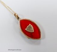 A 19th century engraved yellow metal and carnelian set navette shaped locket pendant, 31mm, on a