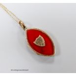 A 19th century engraved yellow metal and carnelian set navette shaped locket pendant, 31mm, on a