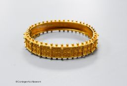 A cased Victorian yellow metal cannetile work hinged bracelet, inner diameter 55mm, 19.1 grams(a.