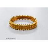 A cased Victorian yellow metal cannetile work hinged bracelet, inner diameter 55mm, 19.1 grams(a.